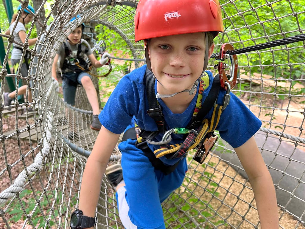 boy in a climbing net