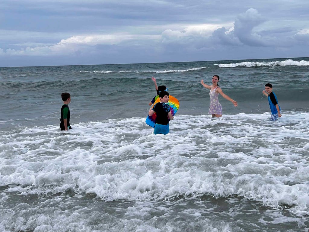 kids swimming in the ocean
