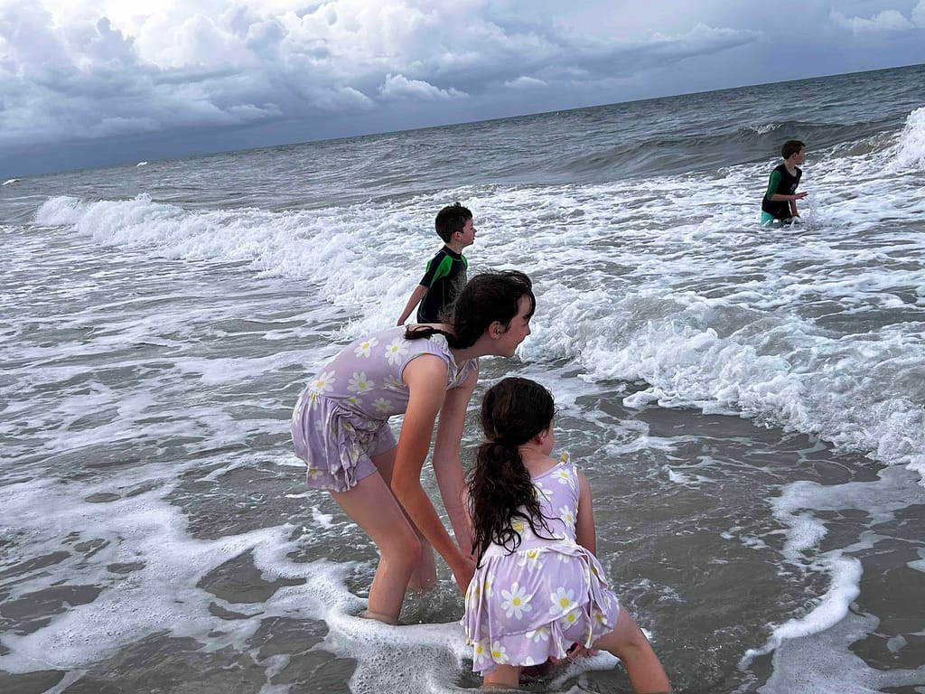kids swimming in the ocean