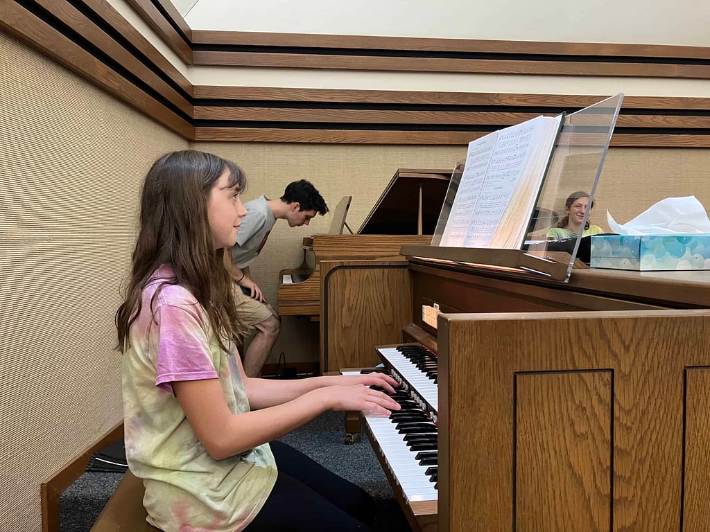 13 year old girl plays the organ at church