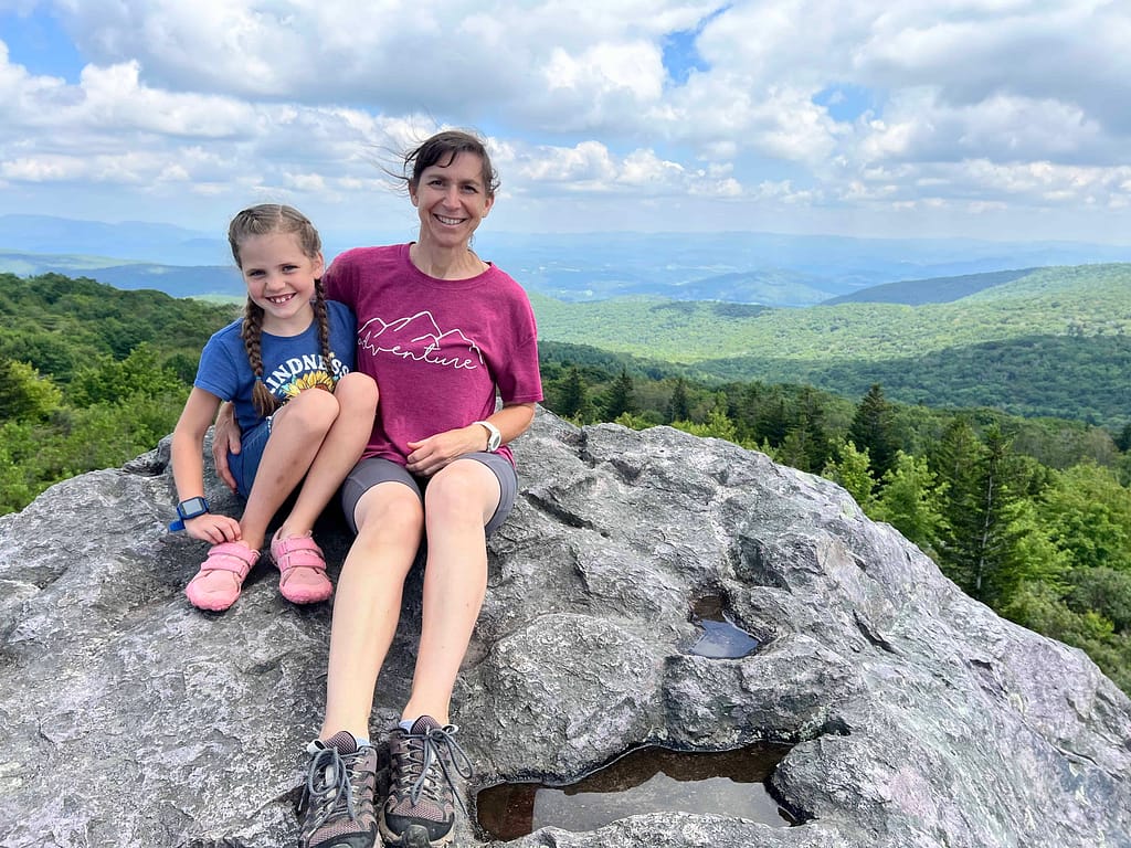 mom and daughter sitting on boulders at Grayson Highlands