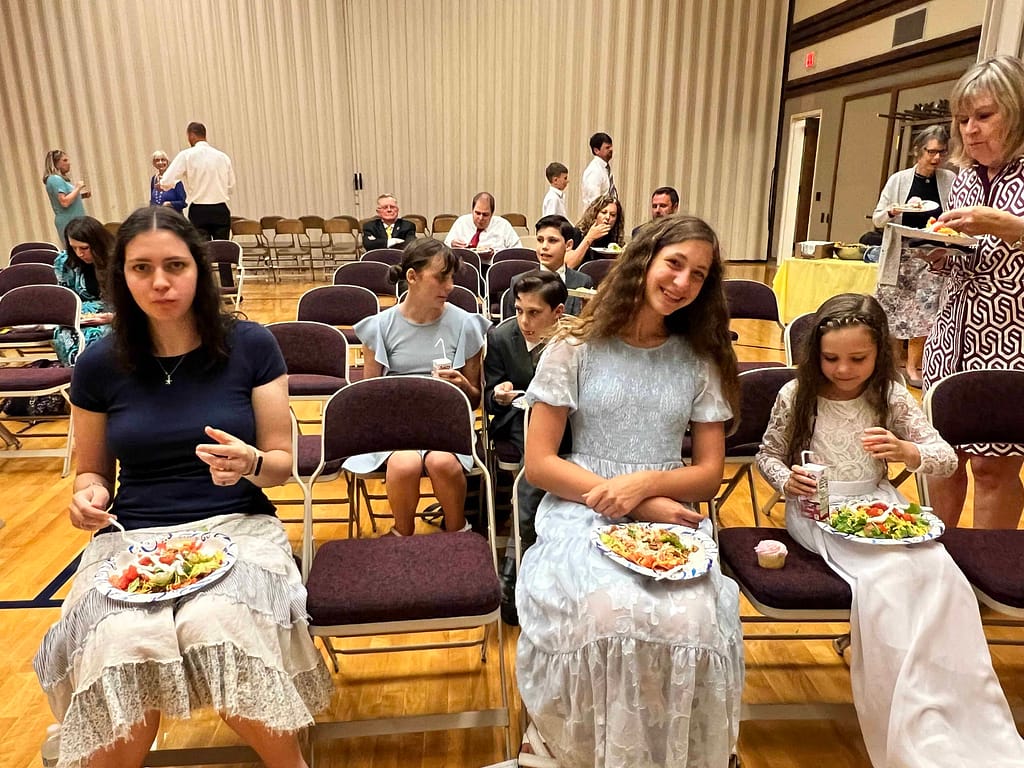 people eating at church social