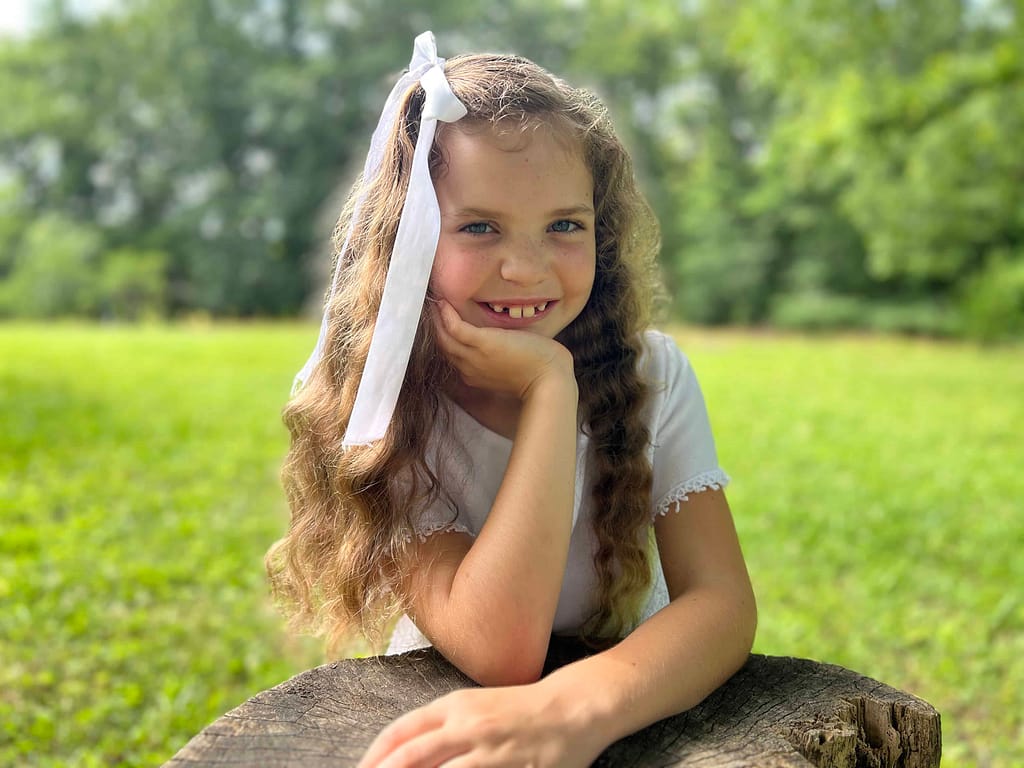 8 year old in baptism dress