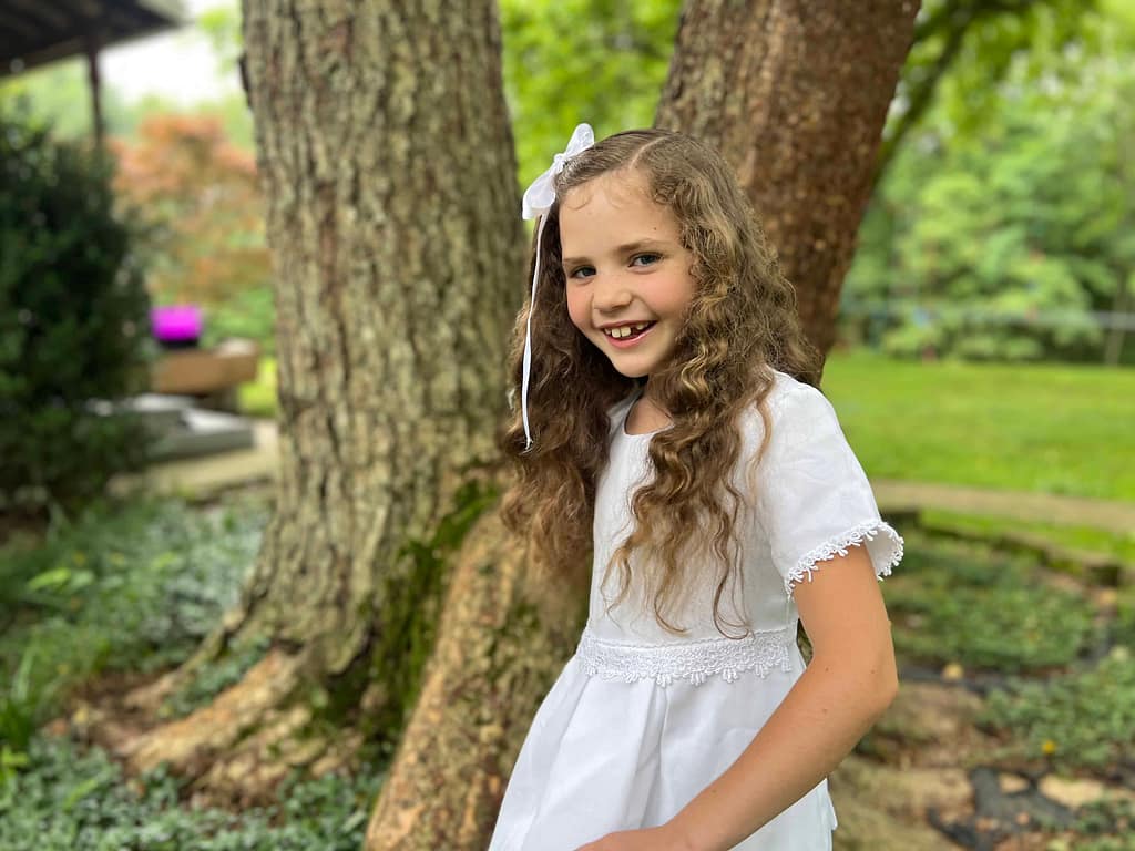 8 year old in baptism dress