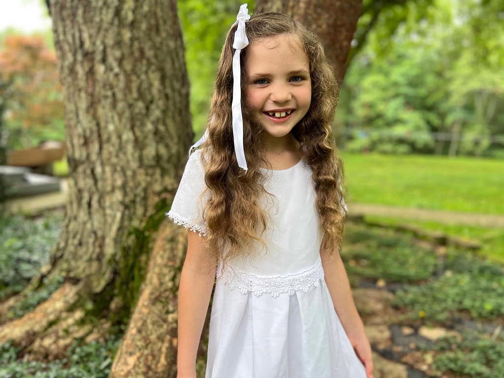 8 year old girl dressed in white
