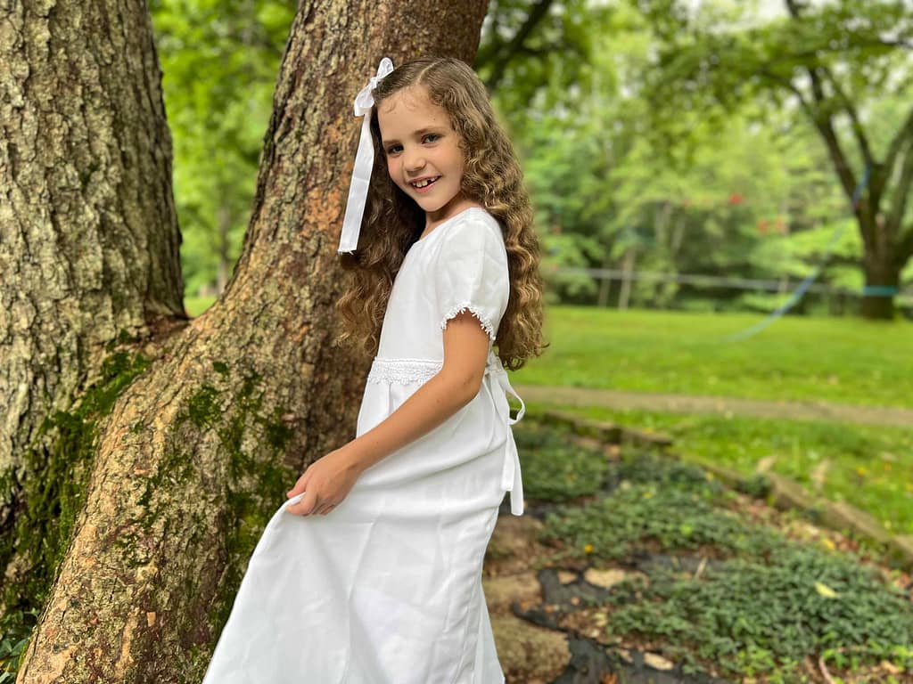 girl dressed in white for her baptism
