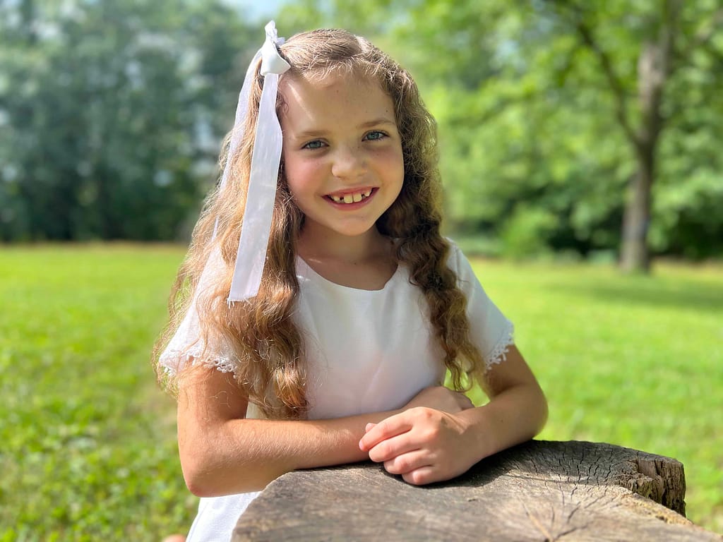 8 year old girl dressed in white