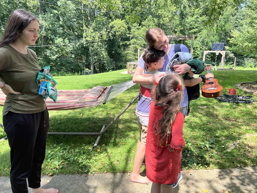 siblings hugging goodbye