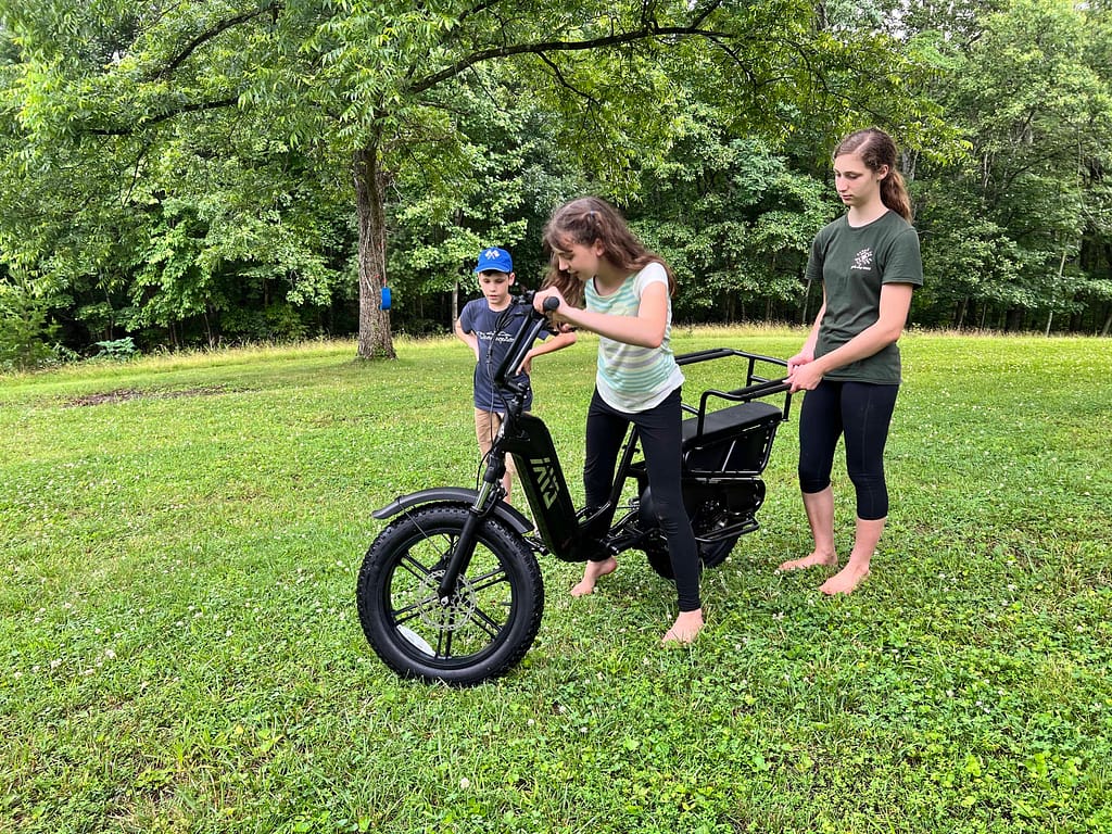 two sisters looking at an ebike