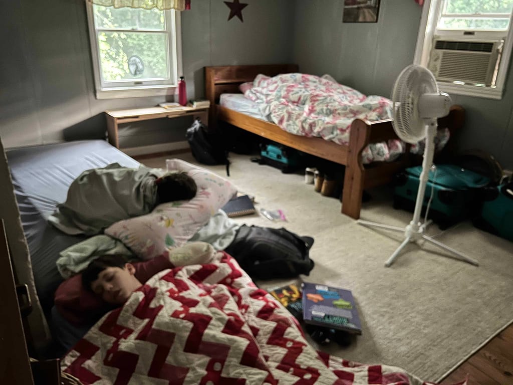 3 kids sleeping in bedroom