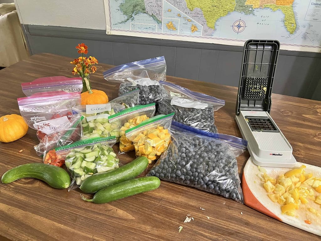table full of garden food in plastic bags
