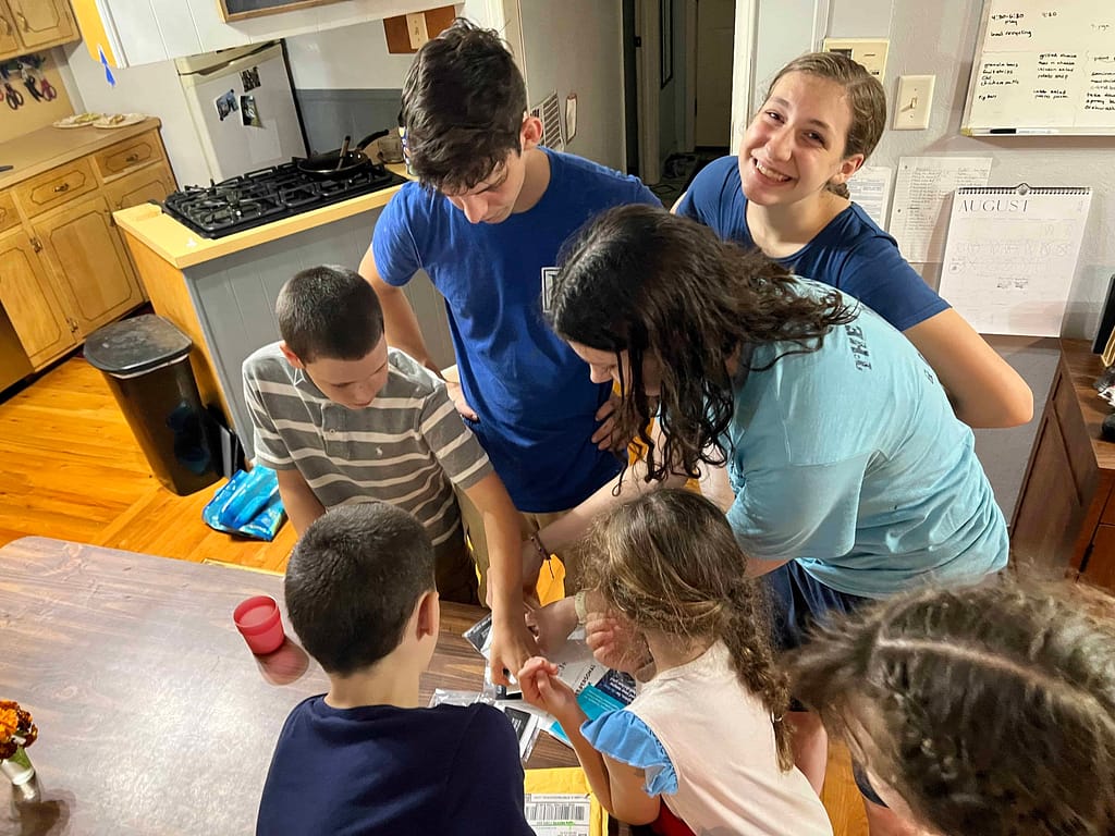 kids looking at something on the table