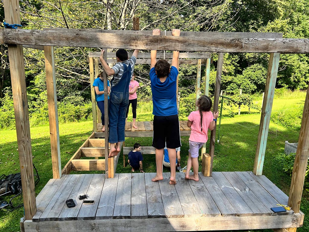 kids hanging out on an obstacle course