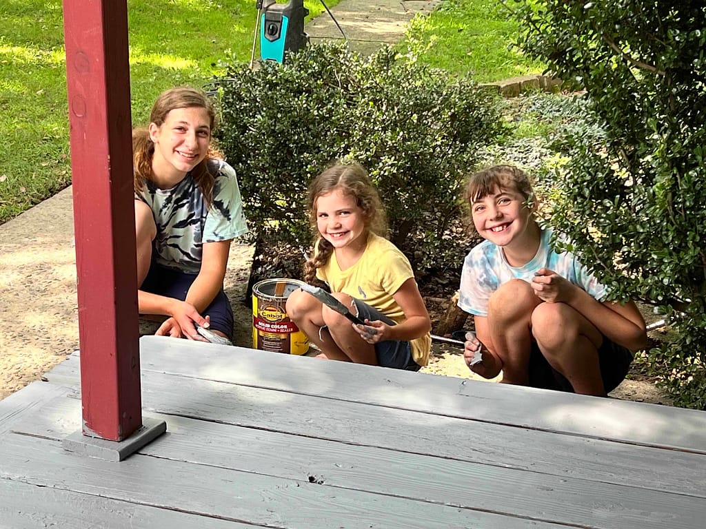 3 sisters painting the porch