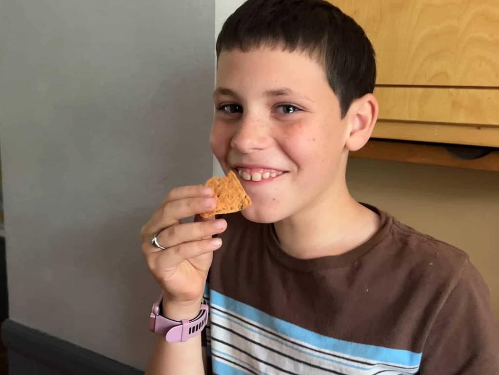 boy eating a tortilla chip