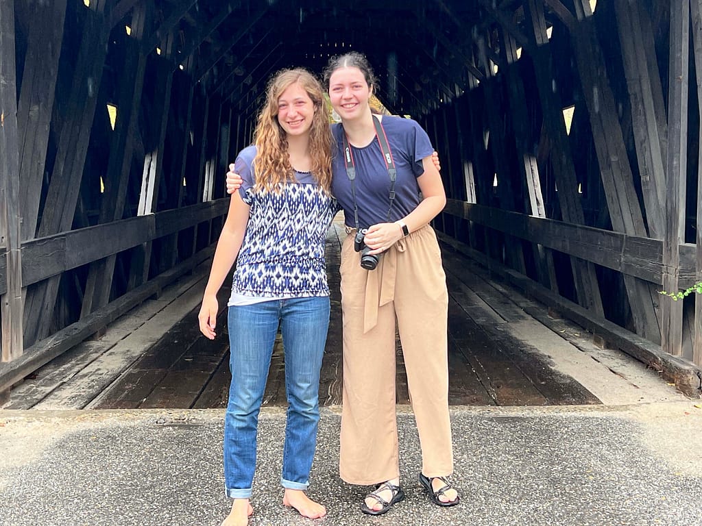 2 sisters in old covered bridge