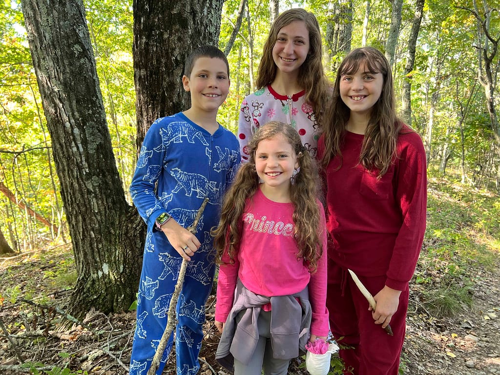 4 kids hiking in pajamas
