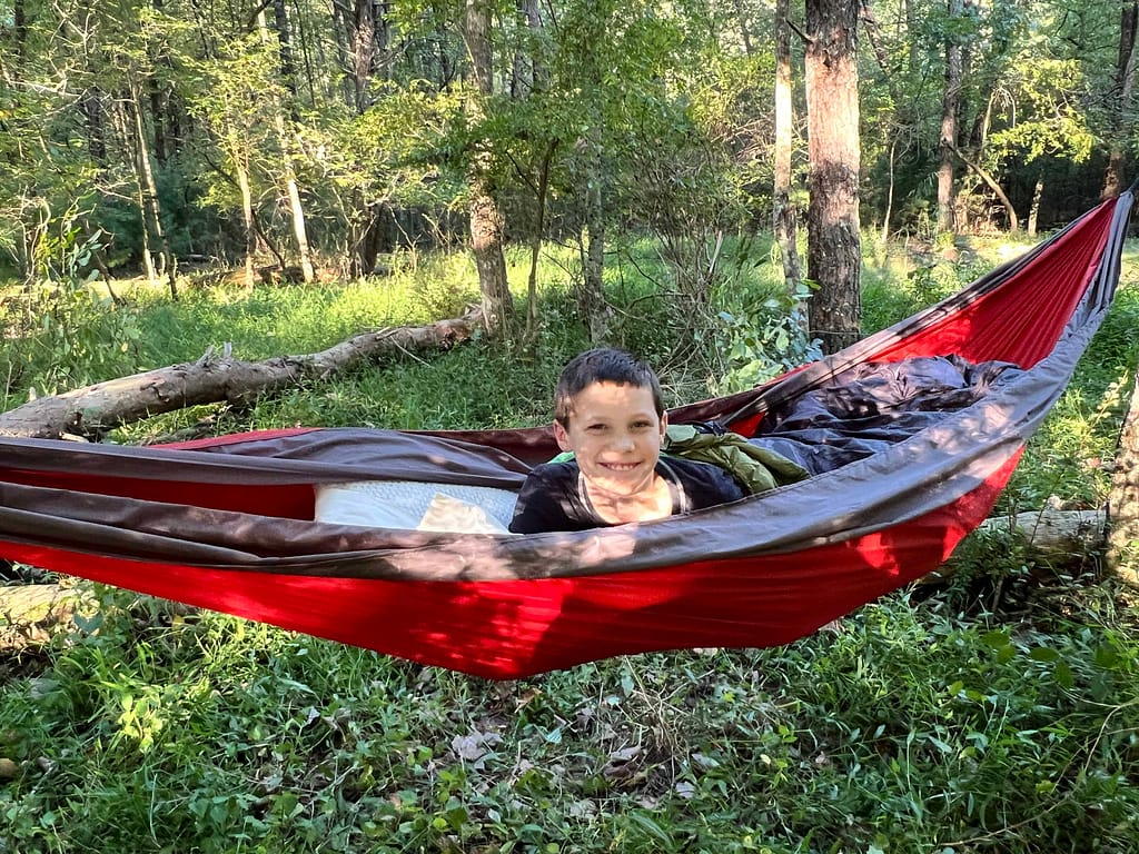 boy laying in hammock