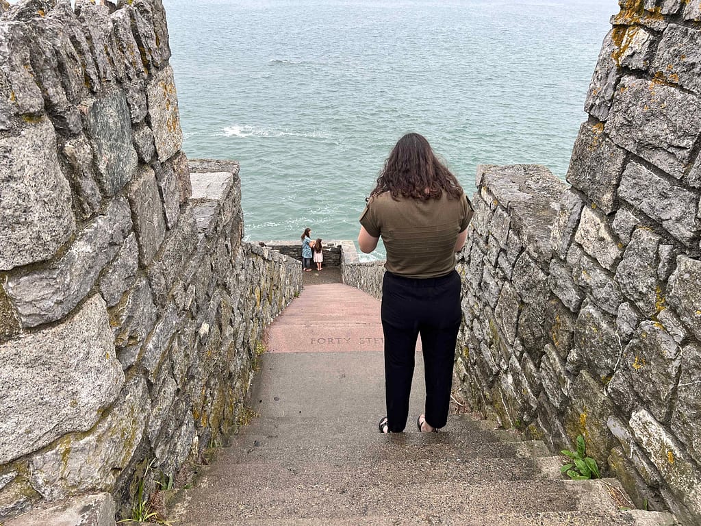woman taking pictures at 40 stairs