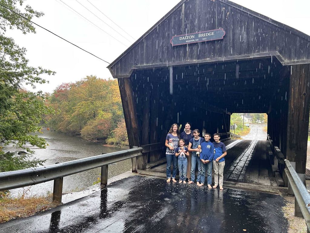 6 kids at a covered bridge