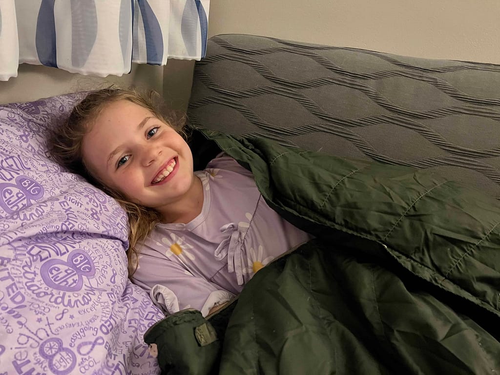 girl sleeping on couch in hotel