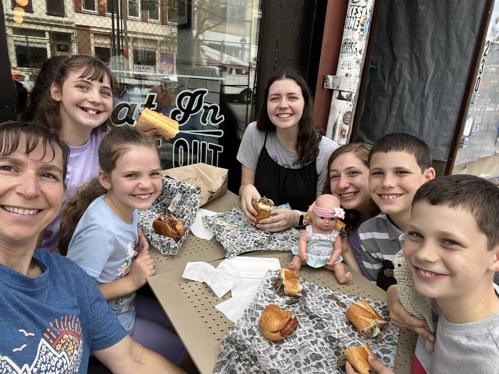kids eating Philly cheese steak in Philly