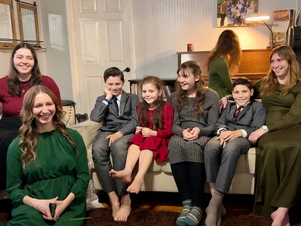 family of 8 kids doing a perfect pitch test