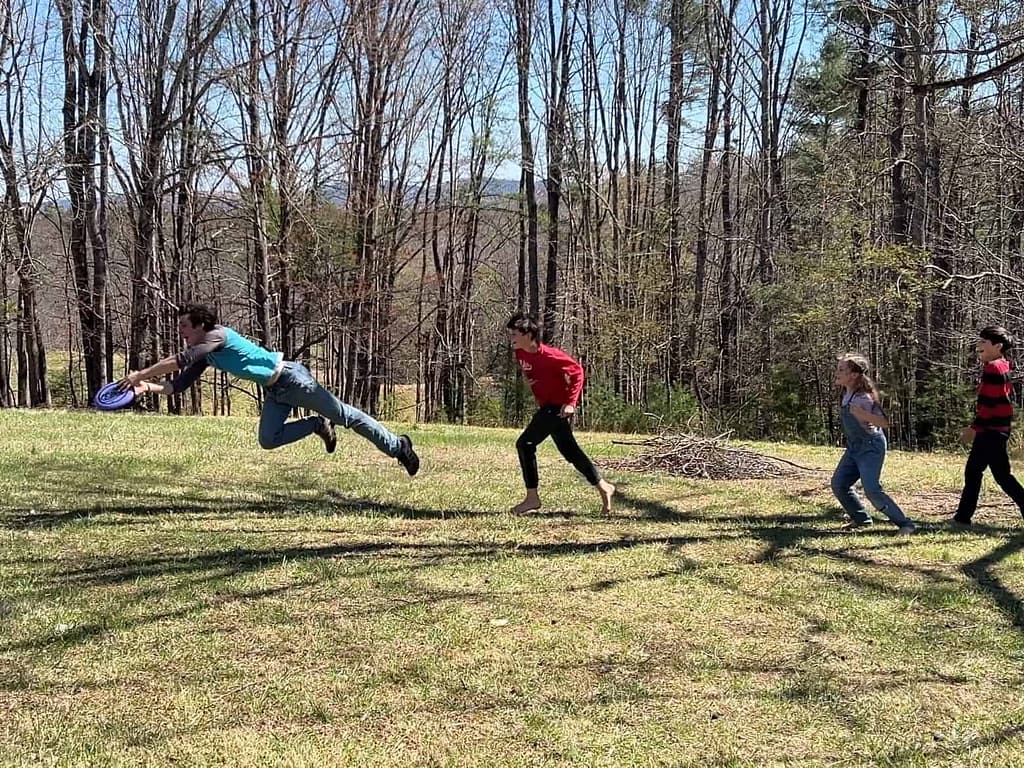 boy makes frisbee catch