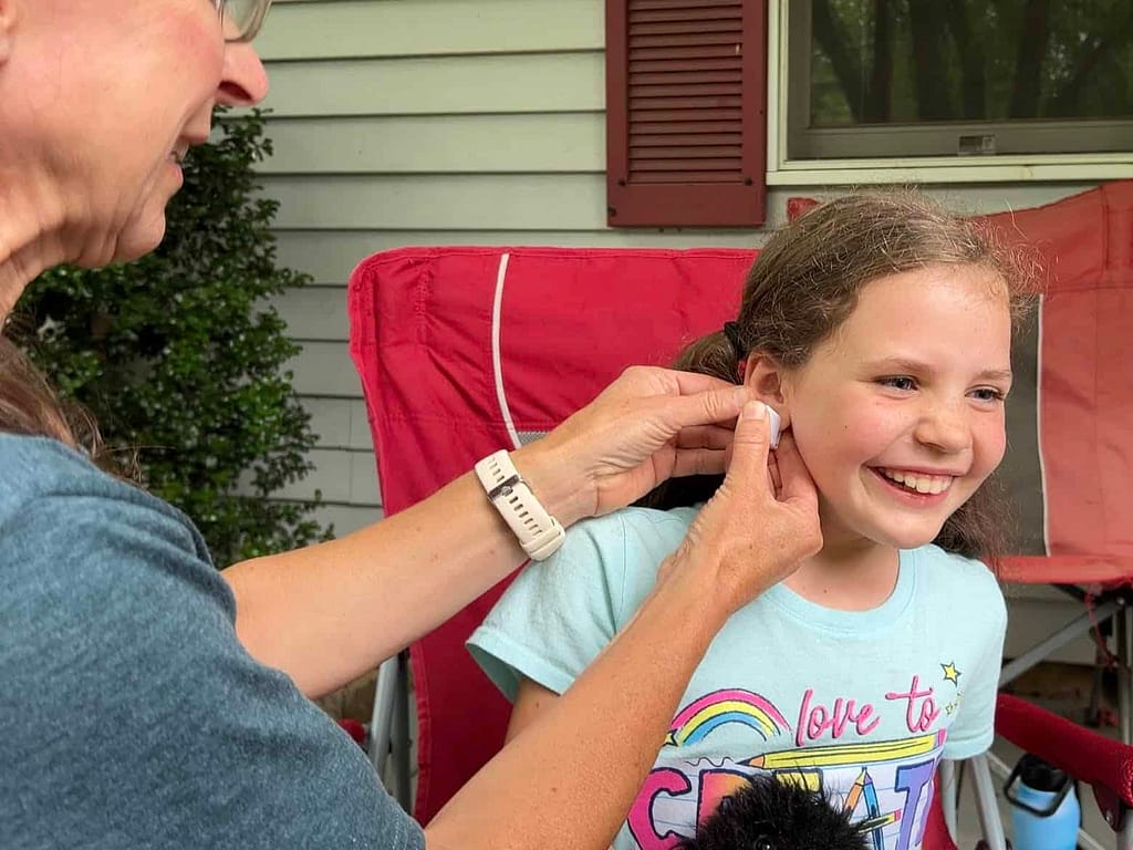 girl getting ears piereced