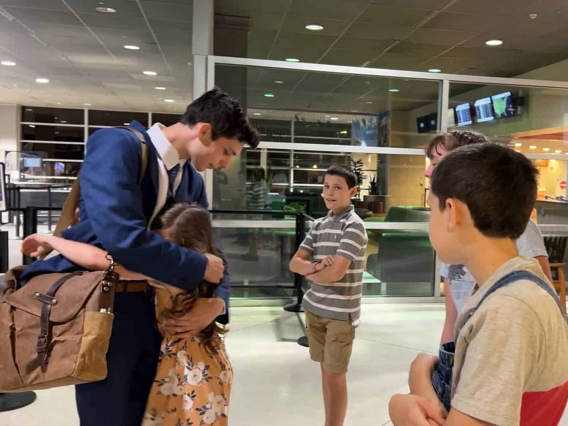 missionary elder saying goodbye to his siblings