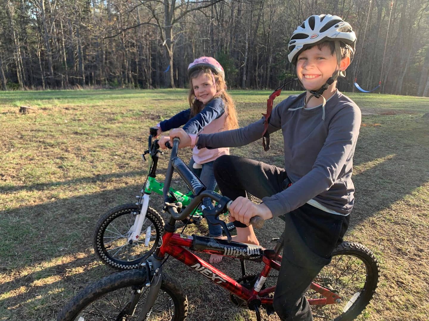 kids riding bikes around the country yard