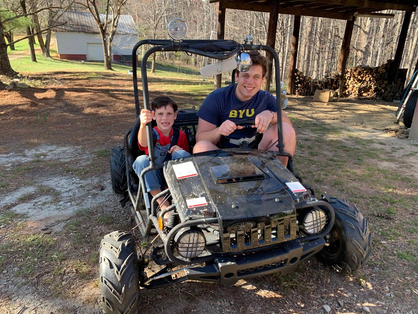 two siblings in a gocart