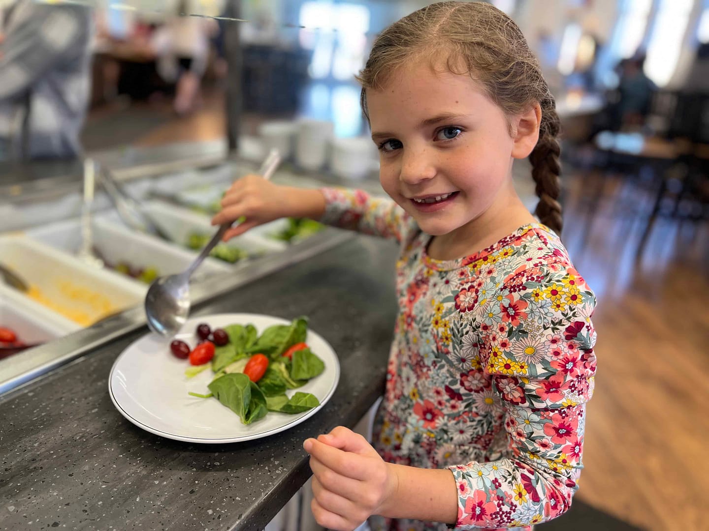 7 year old girl dishing up food