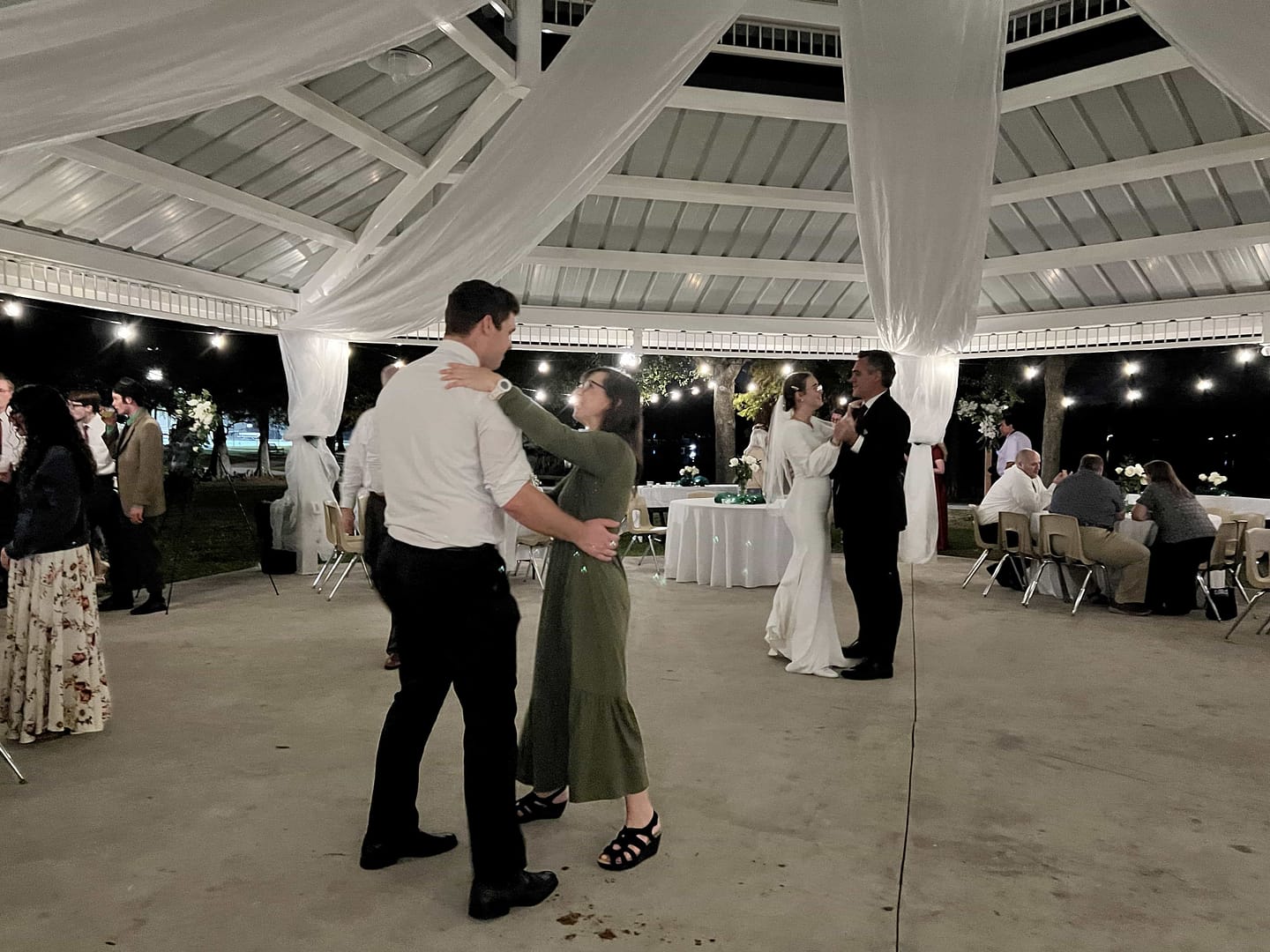 mother dancing with her son at his reception