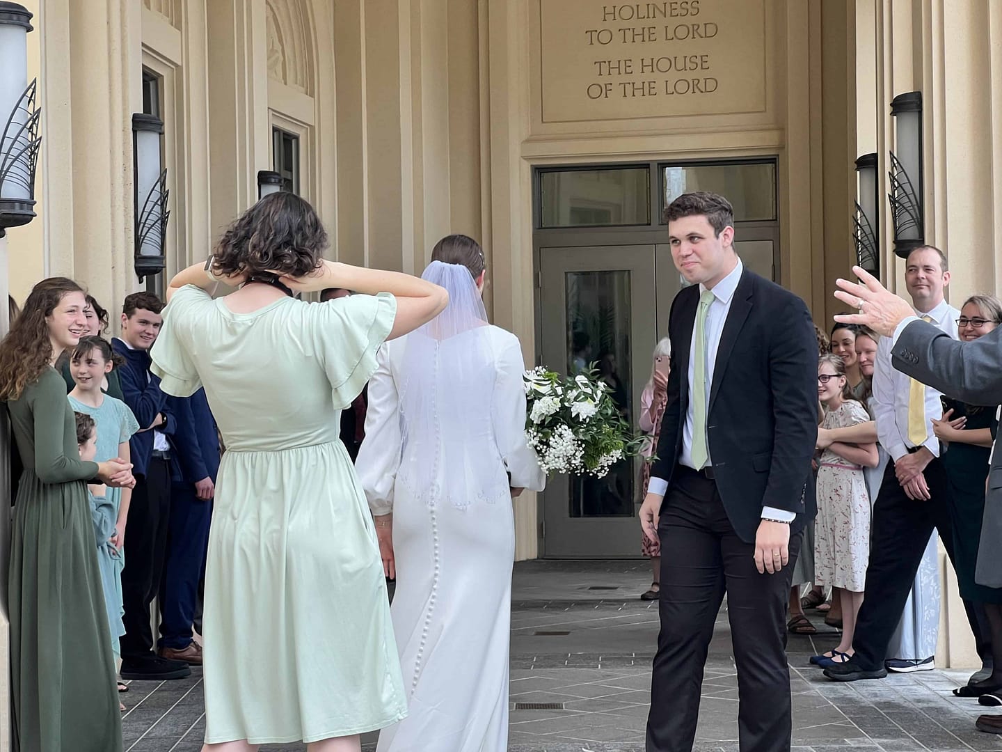 bride and groom coming out of the temple
