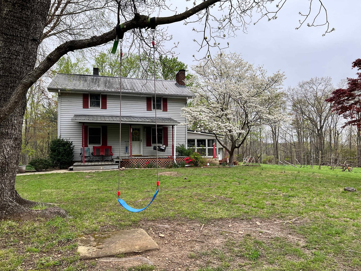 white farmhouse in spring