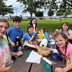 family eating picnic at New Bern waterfront