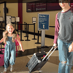 brother and sister get off the airplane