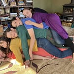 5 children stacked up looking like a rainbow