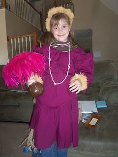 girl dressed up in Hawaiian clothes