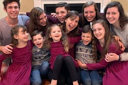 single mom and 10 kids group hug