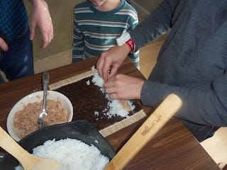 kids making sushi when learning about Hawaii