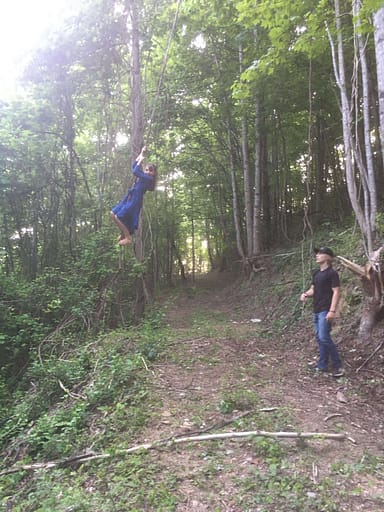 girl swinging on a vine