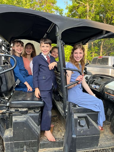 family riding on a mule 4 wheeler