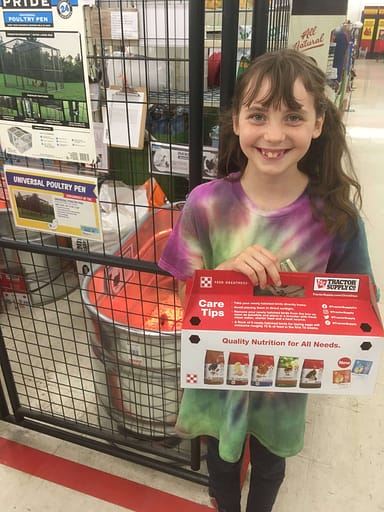 11 year old holding a new box of chicks