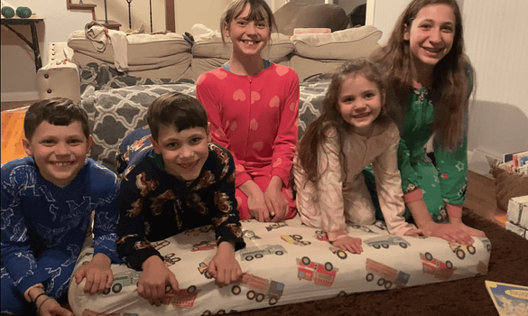5 little kids acting out Five Little Monkeys Jumping on the Bed