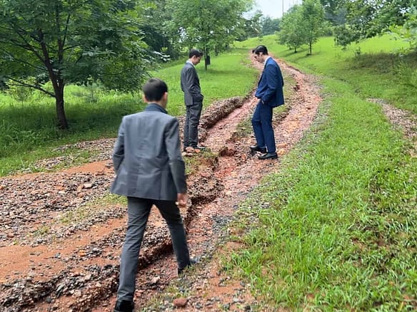 3 brothers inspecting a ruined driveway