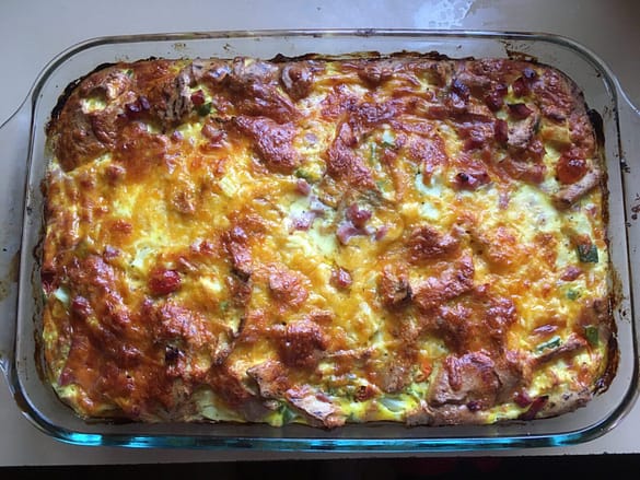zucchini egg strata in a glass baking dish