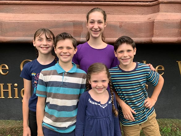 5 kids standing in front of the biggest dresser in the world High Point