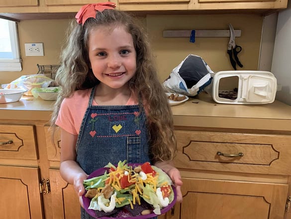 6 year old making taco salad